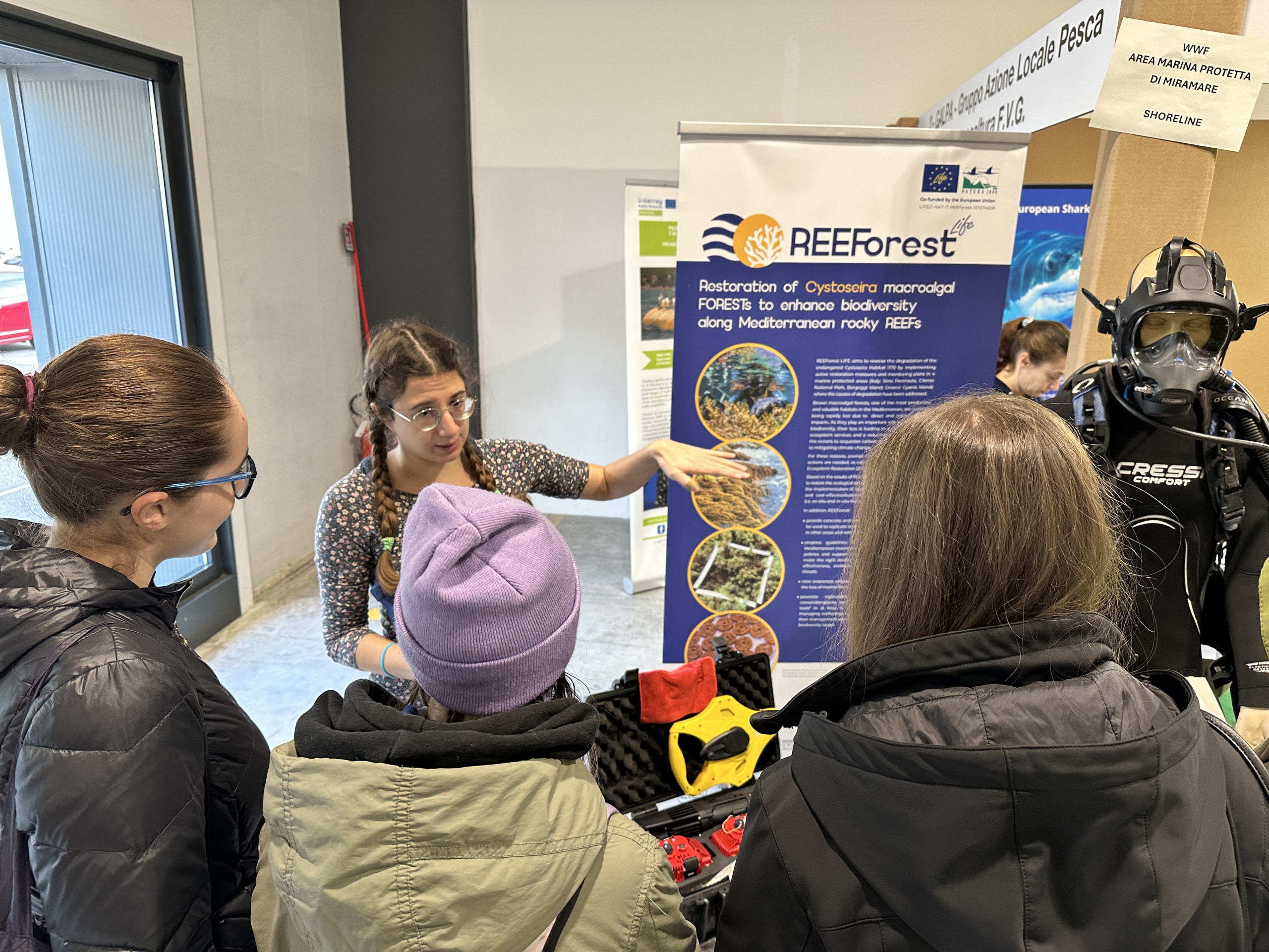 Our staff describing the REEForest project to high school students